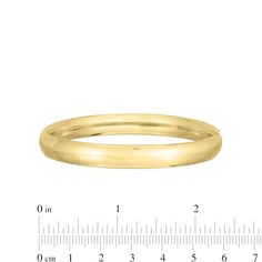 Complement any attire with the simple and sleek design of this polished bangle bracelet in 14K gold. Fashioned in 14K gold This classic bangle shines with a polished 8.0mm tube. This bracelet measures 7.0 inches in circumference and secures with a hinged clasp. Classic 14k Gold Bangle For Formal Occasions, Classic 14k Gold Formal Bangle, Classic Formal 14k Gold Bangle, Thick Band Bangle With Polished Finish For Formal Events, Formal Thick Band Bangle With Polished Finish, Classic 14k Gold Bangle With Shiny Finish, Elegant Thick Band Bangle With Polished Finish, Classic 14k Gold Bangle Bracelet, Minimalist Polished Bangle For Formal Occasions