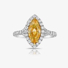 Beautiful Marquise Orange diamond set in a delicate Platinum ring with 0.62ct of rounds The diamond faces up predominantly orange Yellow Oval Sapphire Diamond Ring, Oval Yellow Sapphire Ring With Diamonds, Yellow Marquise Rings For Anniversary, Yellow Oval Brilliant Cut Diamond Ring, Yellow Diamond Ring With Center Stone, Dazzling Oval Yellow Ring, Dazzling Yellow Oval Ring, Yellow Topaz Ring With Halo Setting, Yellow Topaz Halo Ring Fine Jewelry