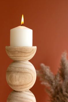 Give these neutral candle holders a roll. These holders, which look like stacked wooden balls, are the perfect neutral touch for your table, mantle, or bookshelf. They suit any style of decor and make a great gift. *Candles not included Large: 5.5"d x 16.5"t Small: 5.5"d x 12.5"t Hand Carved Candles, Ball Candles, Beautiful Candle, Candle Carving, Wood Product, Wood Candle Holders, Led Candle, Wood Candles, Candle Holder Set