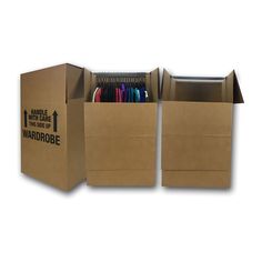 two cardboard boxes with pens and pencils in them