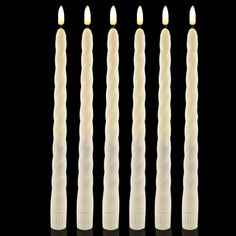 four candles are lined up in the shape of an eight - pointed candle, with one lit