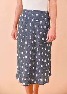 We are loving this fun & flirty midi skirt for any season! A pretty blue and beige floral print dances across this flattering, midi cut, woven fabric as it tumbles from a high waist. Pair this pretty piece with a distressed tee, knit, or a lacy cami for a perfect date-night ensemble! Hidden side zipper Lined 100% Polyester, 100% Rayon (lining) True to size Our model Karin is wearing a size Small Blue Flowy Floral Print Bottoms, Flowy Summer Midi-length Bottoms, Flowy Midi Length Skirt For Brunch, Summer Midi Skirt In Rayon, Summer Midi Length Rayon Skirt, Summer Midi-length Rayon Skirt, Trendy Summer Midi Length Bottoms, Trendy Summer Midi Bottoms, Flowy Floral Print Rayon Skirt