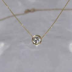 Our most requested necklace for the holidays, featuring a timeless half carat solitaire diamond necklace. Simplistic beauty with unparalleled sophistication. DETAILS: - .50 carat solitaire diamond, G SI+, 5.5 mm - Set in a 14k gold bezel setting - 14k gold cable chain with a lobster clasp closure, 0.5 mm - Custom/larger chains are available upon request - Available in 14k white, yellow or rose gold - Sizes 15 - 20 inches *18k gold and custom lengths available upon request **GIA or EFL certified Diamond Solitaire Necklaces, Bezel Set Diamond Necklace, Fine Jewelry 14k Gold Solitaire Necklace With Brilliant Cut, Bezel Diamond Necklace, Classic Solitaire Necklace With Bezel Setting, 14k Gold Solitaire Necklace With Round Cut, Timeless 14k Gold Solitaire Diamond Necklace, Timeless Yellow Gold Solitaire Necklace With Round Cut, Gold Solitaire Necklace With Lab Grown Diamond For Anniversary