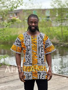 This beautiful dashiki dress / shirt can be worn by both men and women. It may be paired with jeans, leggings or a waist belt to make it more defined. For some, it can also be worn as a mini dress. This dress / shirt is perfect for any occasion. This shirt should traditionally be worn oversized. Short Sleeve Shirt Made of 100% Cotton 2 Front pockets Handwash recommended if possible or machine wash inside out at maximum 40 degrees celcius. (Please note: Every dashiki shirt is unique, because they African Print Top, Dress African Print, Dashiki Shirt, Dashiki Dress, African Print Tops, Mens Dress Shirts, Dress African, Mens Dress, Jeans Leggings