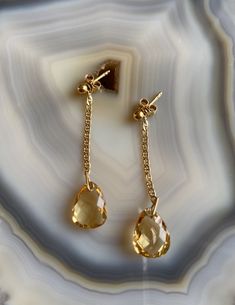 Delicate, feminine and so gorgeous! This is an 18k Gold Filled Earrings featuring a beautiful polished Citrine gemstone. You can see how clear is this stone’s cut. Amazing! Citrine is a great gem to wear to increase motivation! You will love how it will match a lot of your outfits! Product Details: . Size: 2” . Material: 18k Gold Filled Elegant Citrine Gemstones With Gemstone Accents, Elegant Citrine Birthstone Jewelry, Elegant Citrine Jewelry With Gemstone Accents, Yellow Gold Briolette Citrine Earrings, Timeless Drop Earrings As Gift, Luxury Citrine Jewelry With Matching Earrings, Topaz Drop Jewelry For Gifts, Elegant Citrine Gemstones For Wedding, Elegant Briolette Crystal Earrings Gift