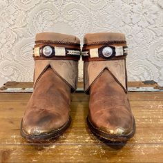 Handcrafted Brown And Beige Nocona Western Cowgirl Ankle Booties Women’s Size 8 1/2 M. I’ve Taken A Pair Of Vintage Nocona Cowgirl Boots Antiqued Them And Have Added Beige Embroidered Tops And A Western Belt. One Of A Kind And Sure To Turn Heads. Handmade And Vintage Items Will Not Be Perfect But I Try To Capture Any Flaws In Photos Tag: Nocona Size 8 1/2 M Heel To Toe: 11” Heel: 2” Height: 6” Ball: 3 1/2” Brown Western Booties With Snip Toe, Western Ankle-high Booties, Western Brown Ankle-high Booties, Western Brown Booties With Round Toe, Brown Western Booties With Round Toe, Western Style Brown Ankle Booties, Western Style Brown Leather Booties, Brown Leather Western Booties, Nocona Boots