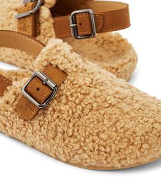 Faux shearling slippers in beige - Il Gufo | Mytheresa Comfortable Slip-on Slippers With Buckle Closure, Shearling Slip-on Slippers With Textured Footbed, Shearling Slippers With Textured Footbed And Round Toe, Brown Slip-on Slippers With Buckle Closure, Brown Closed Toe Slippers With Buckle Closure, Shearling Slippers, Slippers