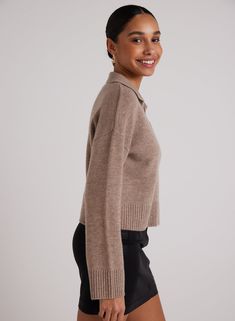 This luxurious sweater, designed from a premium wool and cashmere blend, features a stylish V-neck design that combines elegance with comfort. Perfect for all occasions, it offers a warm and sophisticated look, ensuring you stay cozy while making a fashion statement. 70% Wool 30% Cashmere SIZE CHEST SHOULDER TO HEM XS 38" 20 1/2" S 40" 21" M 42" 21 1/2" L 44" 22" Elegant Merino Wool V-neck Sweater For Fall, Cozy Wool V-neck Sweater For Work, Chic Wool Sweater With Ribbed Collar, Fine Knit Wool V-neck Sweater For Fall, Elegant V-neck Polo Sweater For Fall, Formal Winter Sweater With Ribbed Collar, Chic Wool Polo Sweater For Winter, Chic Winter Wool Polo Sweater, Cashmere Polo Sweater With V-neck And Ribbed Collar