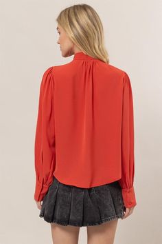 Get ready to add some playful flair to your wardrobe with our Ruffles Blouse! Featuring long balloon sleeves with buttoned cuffs, a pretty tie-neck, and gentle ruffles at the front, this blouse brings fluttery movement to any outfit. The button-down bodice offers a classic fit and ends with a rounded hem for a stylish touch. 100% Polyester Chic Button-up Puff Sleeve Top For Fall, Chic Solid Color Puff Sleeve Top With Ruffles, Long Sleeve Puff Top With Ruffles For Work, Puff Sleeve Long Sleeve Top With Ruffles For Work, Puff Sleeve Top With Ruffles For Work, Ruffled Long Sleeve Puff Sleeve Top, Long Sleeve Puff Top With Ruffles, Long Sleeve Puff Sleeve Top With Ruffles, Puff Sleeve Long Sleeve Top With Ruffles