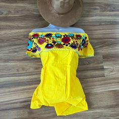 One Of A Kind Hand Embroidered Off The Shoulder Bohemian Top One Size Follow Me On Ig @Vanesaboutiqueny Hat Sells Separately Yellow Embroidered Beach Top, Fitted Embroidered Beach Top, Yellow Embroidered Top For Beach, Embroidered Yellow Tops For Vacation, Yellow Floral Embroidery Blouse For Vacation, Yellow Embroidered Top For Vacation, Embroidered Yellow Summer Blouse, Yellow Embroidered Summer Blouse, Embroidered Yellow Blouse For Summer