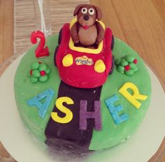 a birthday cake for a child's first birthday with a dog on the top