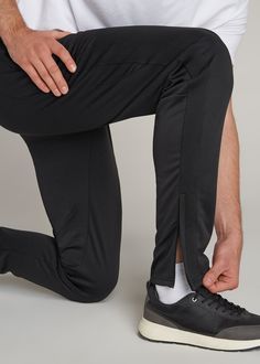 About Our Tall Men's Pants These men's tall athletic pants are a classic take on an athleisure essential. When it comes to athleisure, a good fit is key. You need something that's comfortable enough to relax in yet capable enough to work out in – but as a tall guy, it can be hard to find options that work for your height. You either have to compromise on a baggy fit or settle for lengths that are way too short. Not anymore. We know how hard it is to find quality styles when you're tall, which is Black Tapered Leg Activewear For Jogging, Black Tapered Leg Athleisure Activewear, Sportswear Sweatpants With Straight Hem, Black Tapered Leg Sweatpants In Athleisure Style, Black Tapered Leg Athleisure Sweatpants, Straight Hem Sportswear Sweatpants, Black Tapered Leg Activewear For Sports, Functional Moisture-wicking Tapered Leg Bottoms, Sporty Sweatpants With Straight Hem For Sports