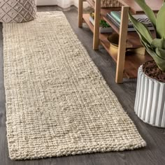 a living room with a rug on the floor