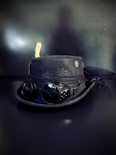 Our black steampunk hat with black goggles radiates sophistication, join the steampunk revolution and claim your spot among the fashion-forward. Perfect for themed events, cosplay, or adding a dash of steampunk to your everyday attire.


Age Group/Gender - Adult/Unisex

Size/Type - One size fits all adults

Color - Black Black Steampunk Hat, Black Steampunk Hats And Headpieces For Cosplay, Steampunk Black Halloween Hat, Black Leather Steampunk Top Hat, Black Goggles, Veil Hat, Steampunk Hats, Black Steampunk, Steampunk 4" Top Hat