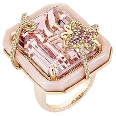 An ancient Kunzite ring with a butterfly studded with pink opal and pink tourmaline that add to the beauty of the ring and with studded diamonds on both sides of the Kunzite that add to the beauty of the ring is shown. This ring is composed of rose gold and is quite attractive. Kunzite Fancy Ring in 18Karat Rose Gold with Pink Tourmaline, Pink Opal and White Diamond. Kunzite: 42.79 carat, 22X17mm size, octagon shape. Pink Tourmaline: 0.09 carat, 1.40mm size, round shape. Pink Tourmaline: 0.09 ca Luxury Pink Gemstone With Center Stone, Luxury Multi-stone Pink Gemstones, Luxury Pink Multi-stone Gemstones, Luxury Yellow Gold Opal Ring With Gemstone Accents, Luxury Tourmaline Gemstones With Accent Stones, Pink Diamond Gemstones With Accents, Diamond Butterfly Ring With Gemstone For Formal Occasions, Luxury Butterfly Ring With Gemstone For Wedding, Luxury Pink Gemstones For Wedding