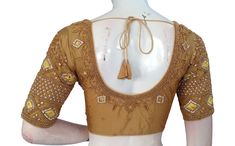 Adorn your bridal ensemble with this breathtaking handcrafted Indian silk saree blouse, meticulously crafted in the USA and embellished with the radiant artistry of gold-colored Aari embroidery. Made from the finest silk fabric, this blouse drapes gracefully, its rich texture complementing the intricate Aari work that adorns it. * This Is A Fully Stitched Saree Blouse, Ready To Wear * Made of Semi silk, Lined With Cotton * Opens From Front With Hook and eye-fitting MEASUREMENTS: Sleeve: 10.5 inc Gold Silk Choli With Zari Work, Gold Embroidered Silk Choli, Gold Blouse Piece With Resham Embroidery For Diwali, Gold Raw Silk Blouse Piece With Resham Embroidery, Gold Resham Embroidered Raw Silk Blouse Piece, Gold Resham Embroidery Raw Silk Blouse Piece, Gold Art Silk Blouse Piece For Reception, Gold Blouse Piece With Resham Embroidery For Designer Wear, Gold Art Silk Blouse For Reception