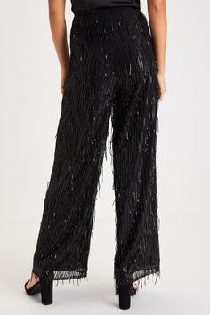 The most glamorous way to elevate any late-night look is with the Lulus Shimmery Aura Black Sequin Fringe High-Rise Wide-Leg Pants! Dazzling fringe-y sequin details adorn these mesh pants that feature a flattering high-rise fit and trendy wide pant legs that fall to full-length hems. Hidden side zipper/clasp. Pair with an equally shiny pair of heels for a truly stunning look! Fit: This garment fits true to size. Length: Ankle length. Size medium Inseam: 29.00 Front Rise: 12.50 Waist: Fitted - ve Elegant Sequined Bottoms For Evening, Chic Sequined Bottoms For Holiday Party, Chic Full Length Wide Leg Pants For Party Season, Glamorous Festive Party Bottoms, Festive Glamorous Party Bottoms, Elegant Sequined Bottoms For Gala, Glamorous High Waisted Wide Leg Pants For Party, Glamorous High Waist Wide Leg Pants For Party, Glamorous Full Length Wide Leg Pants For Night Out