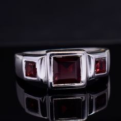 Large Garnet Ring, Handmade Red Garnet Ring, Gemstone Jewelry, 925 Sterling Silver & 18k Gold Fill, Faceted Square Ring, Signet Garnet Ring Description :- Metal :- 925 Sterling Silver/ 18k Gold Filled  Gemstone :- Natural Red Garnet  Stone Shape :- Square Stone Color :- Red   Handmade Items **Made to Order** Delivery Time:- Once Item is shipped parcel will be delivered to you in 2-4 weeks. C U S T O M I Z E O R D E R  All jewelry are made with solid 925 sterling silver. If you want to make any changes in this jewelry, then please send us a message. We accept custom orders also. All jewelry are nickle free. Visit our shop : https://www.etsy.com/in-en/shop/MiharSilverCrafts Formal Red Ruby Ring With Three Stones, Formal Ruby Three Stone Ring, Classic Red Three Stone Rings, Formal Red Three Stone Ruby Ring, Classic Red Three-stone Ring, Formal Red Birthstone Ring With Polished Finish, Formal Red Polished Birthstone Ring, Formal Ruby Three-stone Rings, Formal Red Three Stone Rings