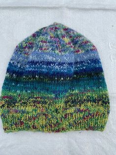 Multicolored hat Size: 48 cm in circumference, H 23,5 cm, very stretchable Removable tassel Combination of exclusive yarns 75 % wool, 25 % polyamid Multicolor Wool Hat For Winter, Knitted One Size Bonnet, Multicolor Knitted Hats One Size, One Size Knitted Bonnet Hat, One Size Brimmed Beanie Made Of Yarn, Adjustable Multicolor Knit Hats, Knitted Brimmed Hat One Size, Multicolor Knitted Cap Hat, One Size Knitted Bonnet