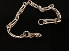 Beautiful vintage sterling silver chain link bracelet with a snap-lock closure. The bracelet has a beautiful design. It measures 8.25 inches in length. There are a few minor superficial scratches. Silver Oval Link Chain Bracelet With Hook, Classic Sterling Silver Bracelet With Hook And Links, Hallmarked Sterling Silver Link Bracelet, Formal Sterling Silver Bracelet With Hook And Links, Vintage Silver Chain Bracelet With Oval Links, Sterling Silver Formal Bracelet With Hook And Links, Sterling Silver Link Bracelet For Formal Occasions, Formal Link Chain Bracelet With Sterling Silver Clasp, Formal Sterling Silver Link Bracelet With Chain Detail