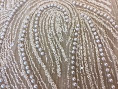 an image of pearls on fabric