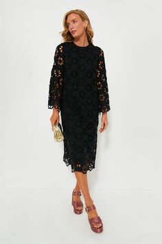 This best-selling silhouette is back in an updated look! The Noir Eyelet Hutton Dress is an elegant style perfect for date nights, dinner parties, and beyond. Featuring unlined floral lace bell sleeves, side slits for ease of movement, and an easy straight silhouette, this look can be styled hundreds of ways. Pair with heels and a clutch or ballet flats and a top-handle bag! Crewneck Long bell sleeves with scalloped edge Back zip closure Straight silhouette Side slits Midi length Lined body, unl Elegant Midi Dress With Cutwork Hem, Chic Midi Dress With Cutwork Hem, Chic Knee-length Midi Dress With Cutwork Hem, Elegant White Lace Dress For Brunch, Spring Evening Dress With Cutwork Hem, Fitted Evening Dress With Cutwork Hem, Long Sleeve Lace Midi Dress For Date Night, Elegant Lace Midi Dress For Brunch, Fall Evening Dress With Scalloped Lace