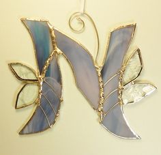 a decorative glass ornament hanging on a wall