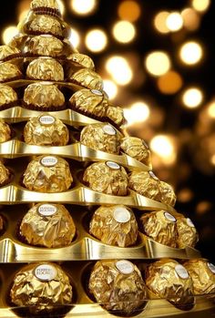 a gold christmas tree made out of chocolates