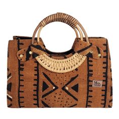 Introducing the Nasika Tote, a stunning handbag crafted from rich mudcloth. This traditional Malian fabric is renowned for its unique texture and cultural significance, making each bag a wearable piece of art. The intricate patterns and earthy tones of the mudcloth create a sophisticated look that's both elegant and eye-catching. With its spacious interior, sturdy cane handles, and inner pocket, this bag is as functional as it is beautiful. Every purchase supports women from low-income weaving c Brown Handwoven Top Handle Bag, Brown Handwoven Bag With Round Handle, Handheld Brown Woven Satchel, Brown Handwoven Handheld Bag, Handwoven Brown Handheld Bags, Brown Woven Satchel With Double Handle, Handheld Brown Handwoven Bag, Traditional Woven Tote Satchel, Eco-friendly Brown Shoulder Bag With Round Handle