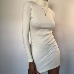 Long Sleeve Mini Dress With Turtleneck Material: 50% Polyester 45% Cotton 5% Elastane Model Stats -5'9.5 -Bust 34c -Waist 27 -Hips 37 Chic Slim Fit Mini Bodycon Dress, Winter Mini Length Slim Fit Dress, Winter Slim Fit Mini Dress, Fitted White Mini Dress For Winter, Fitted High Neck Mini Dress For Winter, Fitted Mini Dress For Winter, White Fitted Mini Dress For Winter, Spring Slim Fit Midi Mini Dress, Fitted Solid Color Bodycon Dress For Brunch