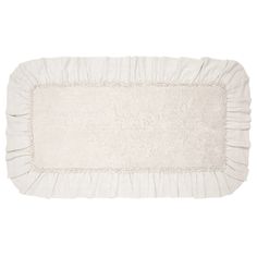 a white rug with ruffled edges