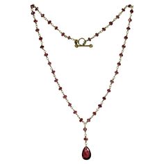 This gorgeous Tiffany & Co. pendant necklace features briolette beads crafted in rhodolite garnet and completed with an 18k white gold clasp. Made in United States circa 1990s. Measurements: 0.35" (9mm) width, 16" (40.6cm) length. Excellent condition. Garnet Beaded Necklace, 18k Gold Necklace, Rhodolite Garnet, Tiffany And Co, Jewelry Inspo, Drop Necklace, Tiffany & Co., Garnet, Favorite Things