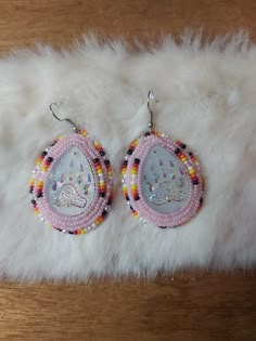 Beaded earrings! Very pretty. Would make a great gift Pow Wow Earrings, Beaded Drop Earrings For Gift, Round Beaded Earrings As Gift, Round Beaded Earrings For Gifts, Elegant Earrings With Colorful Beads For Gift, Dangling Beads Earrings As Gift, Dangling Beads Round Earrings As Gift, Unique Hoop Earrings With Dangling Beads For Gift, Round Earrings With Dangling Beads As Gift