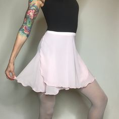 "Our original ballet wrap skirt, Classical Wraps are slightly longer in the back. They are made with a high quality, semi-translucent chiffon that is light weight with beautiful drape. The 5/8\" elasticized ribbon holds the skirt in place while you petite your way across the floor. For details on sizing & length, scroll down to the \"Sizing Information\" link." Fitted Asymmetrical Tennis Skirt For Spring, Fitted Asymmetrical Tennis Skirt For Summer, Fitted Ballet Bottoms For Dance Class, Fitted Asymmetrical Skort For Summer, Elegant Ruffled Flowy Skort, Fitted Solid Color Pleated Swim Skirt, Elegant Fitted Tennis Skirt For Spring, Fitted Balletcore Dance Bottoms, Spring Balletcore Stretch Bottoms