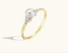 14k Gold Pearl Ring With Single Diamond For Promise, Elegant Pearl Promise Ring With Center Stone, Elegant Pearl Ring With Center Stone For Promise, Elegant Pearl White Promise Ring, Formal White 14k Gold Pearl Ring, Timeless White Pearl Ring In 14k Gold, Elegant White Gold Pearl Promise Ring, 14k Gold Pearl Ring With Prong Setting For Promise, Classic Pearl Promise Ring With Center Stone