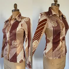 Great print on this 1970s top! Fall Vintage Print Collared Tops, Fitted Brown Printed Shirt, Brown Graphic Print Button-up Top, Retro Vintage Print Blouse For Fall, Patterned Graphic Print Button-up Blouse, Retro Blouse With Vintage Print For Fall, Vintage Brown Floral Print Tops, Fall Retro Blouse With Vintage Print, 1970s Retro Print Long Sleeve Tops