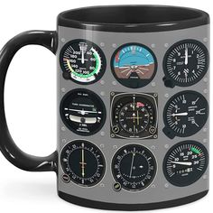 a black and grey coffee mug with various gauges on the front, inside and outside