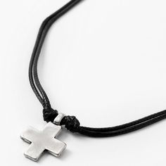 Proudly wear this symbol of your faith! The rustic silver cross pendant hangs from a faux leather double-cord necklace that's knotted to keep the pendant in place. Length: 18" + 3" extender Closure: Lobster clasp Material: Metal, Faux leather - Claire's Rustic Silver Cross Pendant 18" Black Cord Necklace Adjustable Nickel-free Cross Pendant Jewelry, Adjustable Cross Pendant Jewelry, Spiritual Cross Jewelry With Adjustable Cord, Adjustable Nickel Free Cross Pendant Necklace, Adjustable Nickel-free Cross Pendant Necklace, Adjustable Cross Pendant Necklace, Adjustable Nickel-free Crucifix Necklace, Adjustable Silver Cross Necklace, Nickel Free, Adjustable Cross Necklace With Cord