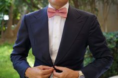 Classically refined, the Nude Pink Velvet Bow Tie adds a romantic perspective to your formal styles. The most popular men’s bow tie for weddings, the Nude Pink Velvet Pre-tied Bowtie exudes an elegant soft pink palette. Designed in-house and superbly handcrafted from a plush velvet, the Nude Pink Velvet Bow Tie immaculately combines a perspective of durability with unsurpassed luxury. Let its smooth, lightly tufted velvet fabric bring a wealth of comfort and texture to your formal styles. The Nu Dusty Rose Bow Tie, Dusty Rose Tie, Pink Pocket Square, Rose Gold Cufflinks, Men's Bow Ties, Texture Socks, Hoco Ideas, Velvet Bow Tie, Dusty Rose Wedding