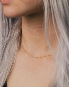 This 14K gold Saturn Chain features 1.7mm faceted bead elements. A unique, modern chain that will become a staple in your wardrobe. NECKLACE DETAILS: Length: 16 Inches & 18 Inches Millimeter: 0.90 Closure: Lobster Average Weight (g): 16" is 1.67 grams; 18" is 1.84 grams Available in 14K Yellow Gold ***These necklaces have a 4 week lead time. If you need your necklace sooner than that, please contact us prior to ordering to verify if that's possible.*** | Faceted Bead Saturn Chain Necklace In 14K Yellow Gold Ring - by Staghead Designs - Unisex Dainty Yellow Gold Beaded Chain Necklace, Minimalist Beaded Chain Gold Plated Necklace, Yellow Gold Cable Chain Choker, Minimalist Gold-plated Beaded Chain Necklace, Dainty Yellow Gold Station Necklace With Satellite Chain, Faceted Yellow Gold Jewelry In Recycled Gold, Minimalist Gold Plated Satellite Chain Necklace, Faceted Yellow Gold Jewelry From Recycled Gold, Yellow Gold Faceted Recycled Gold Jewelry