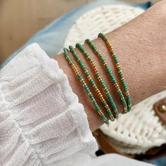 Beautiful delicate wrap bracelet, wraps around your wrist 5 times. Lovely color combination of green with a hint of golden seed beads which gives the bracelet a lovely sparkle. M A T E R I A L * Delica Seed beads from Miyuki ( 2 mm) green & gold * Very strong elastic S I Z E Size medium, 86 cm ( 34 inch), 6.7 inch when wrapped, fits the normal to small wrist. Can be made in any size ( please sent me a message with your order and it will be made for you) S H I P P I N G * All orders are wrapp Peridot Bracelet, Boho Wrap Bracelet, Bracelet Initial, Black Beaded Bracelets, Zodiac Bracelet, Birthday Bracelet, Turquoise Bead Bracelet, Diffuser Jewelry, Seed Bead Bracelet