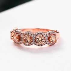 Rose Gold Halo Five Stone Champagne Stone RingEmbedding diamonds by handcraft. Exquisite design made perfect for an engagement ring, wedding ring, promise ring, bridal ring set, anniversary ring, couples ring, and more. Wonderful gifts for birthdays, Mother's Day, Valentine's Day, Thanksgiving, Christmas, and all other occasions.Our mission is to create premium stones that shine like a natural diamond. Gemstone types, shapes, colors, and cuts were carefully designed and handcrafted to perfection Anniversary Rings For Her, Couples Ring, Rose Gold Halo, Diamond Anniversary Rings, Gold Halo, Bridal Ring Set, Champagne Diamond, Ring Promise, Bridal Ring