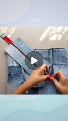 someone is making something out of jeans with scissors