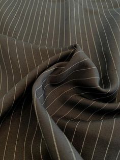 This black and white gangster striped silk suiting designer fashion fabric will take you back to the exuberant, freewheeling popular culture of the Roaring Twenties. SKU: 8479 Content: 100% Silk Color: Black / White Width: 40 inches This fabric is a last cut and no longer in production. Once sold out, we are unable to get more. The Roaring Twenties, Power Dressing, Silk Suit, Roaring Twenties, Stripe Silk, Suit Fabric, Striped Fabrics, Black Suits, Popular Culture