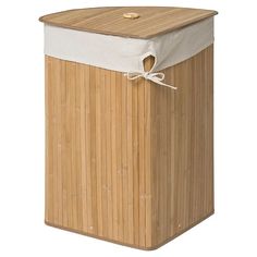 a wooden trash can with a white cover on top