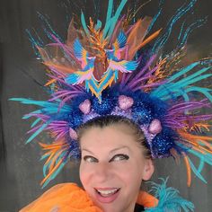 Beautiful Phoenix Fire Mardi Gras headdress could be a great addition to your fun party outfit... Decorated with sparkly blue, orange twigs, sparkly blue balls, pink hearts, colorful mesh, tulle, sequin, ..in the middle two Azure blue, Pink, Gold embroidered Phoenix birds. Blue back side.  Light weight, elastic in the back, fits most heads. Colors might look sliightly different from pictures due to your screen setting. All crowns hand made. Shipped by USPS next business day! NO refunds, NO returns, but please let me know if something wrong with your item.  Check my shop for other Holiday crowns and matching face mask. Contact me for special orders. Thank you for your interest in my design. Have fun, stay safe. Fantasy Festival Headpiece With Round Crown, Carnival Festival Crown Headband, Carnival Round Crown Headpiece, Fantasy Costume Hat With Tall Crown For Festivals, Fantasy Tall Crown Costume Hat For Festival, Carnival Costume Headpiece With Round Crown, Whimsical Crown Costume Hat For Carnival, Whimsical Crown Headpiece For Mardi Gras, Bohemian Crown Costume Hat For Carnival