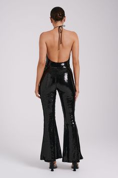 Zero disco ball required.The WILMA are a pair of sparkling wide-legged pants with a high waistline and flared hems. An invisible zipper closure at the side seam gives it a sleek, seamless silhouette. The legs transition into a flattering bootcut that complements its high, fitted waist. Lined sequinned fabrication adds a touch of comfortable glam, making these pants the perfect choice for all-night wear. Black Sequin Pants, Sequin Pants, Night Wear, Cowl Neckline, Sleeveless Bodysuit, Disco Ball, Neck Strap, High Leg, Black Bodysuit