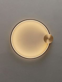 a round light fixture on the wall