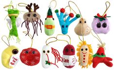 a group of christmas ornaments hanging from strings