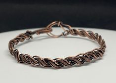 a close up of a bracelet on a table